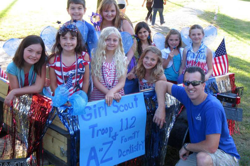 Dr. Massie with Girl Scouts at Parade